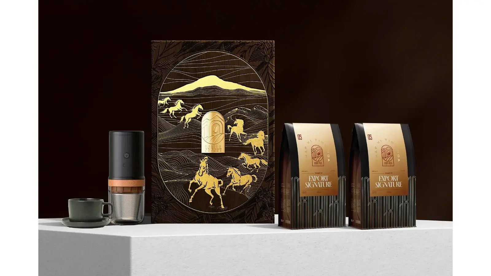 The gift set laid out on a plinth — chest, canister, bags and a cup
