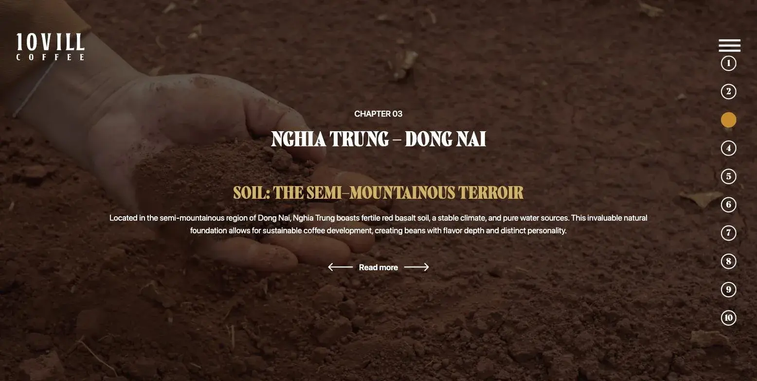 A handful of red basalt soil held above the ground, on the brand website