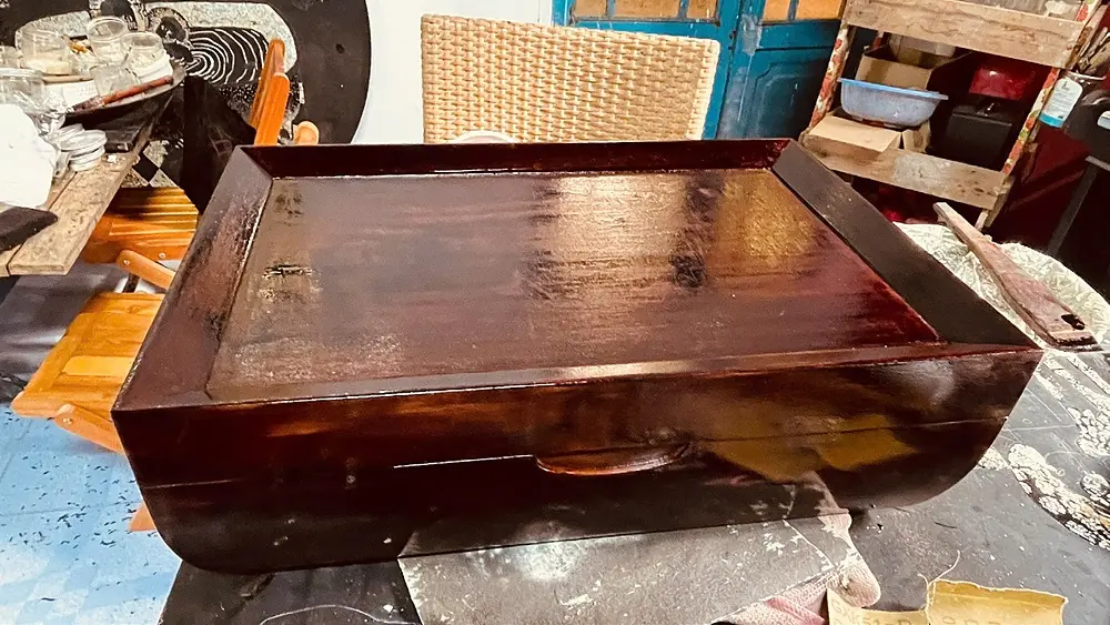 A slab of coffee wood on the bench, grain visible