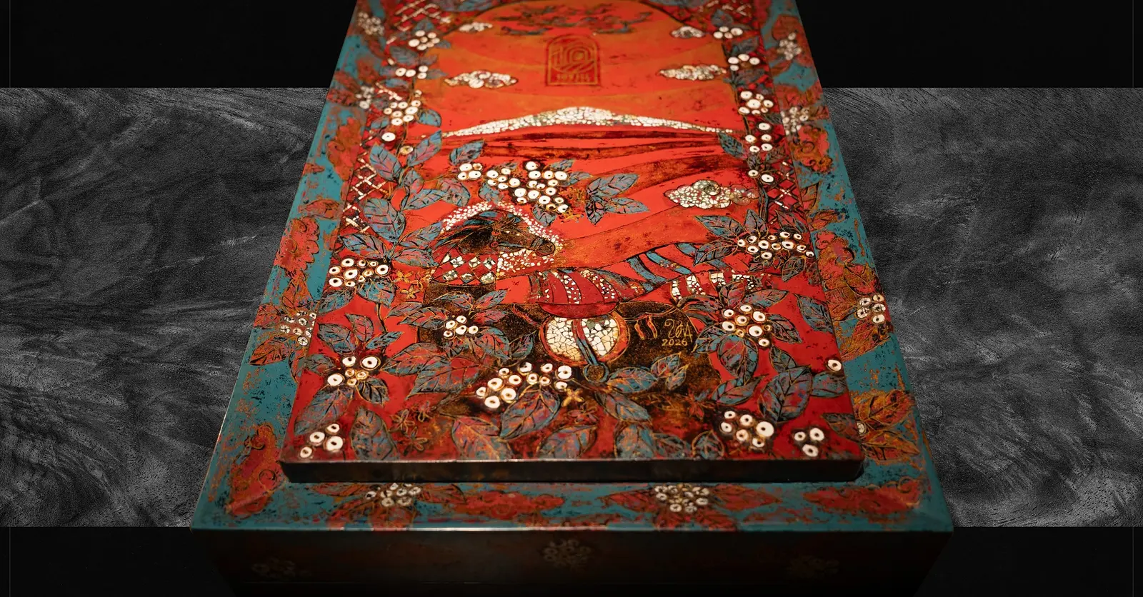 The lid from directly above, the full painted surface reading as one panel