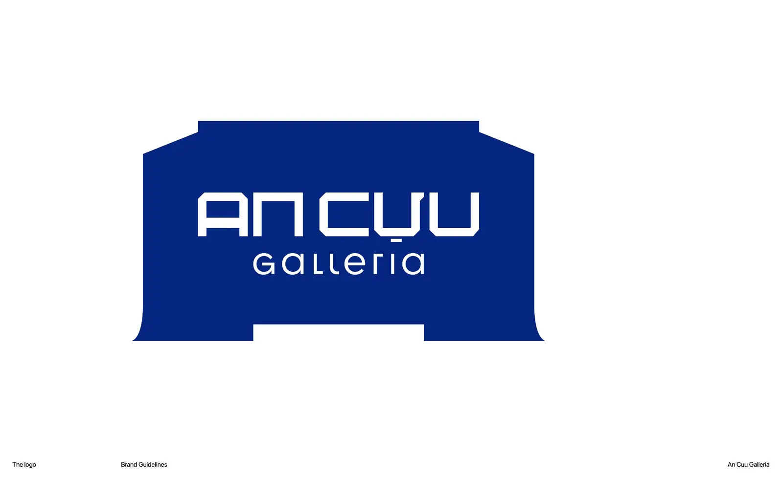 The An Cựu Galleria mark in full colour — a flat trapezoid with an aperture cut through it
