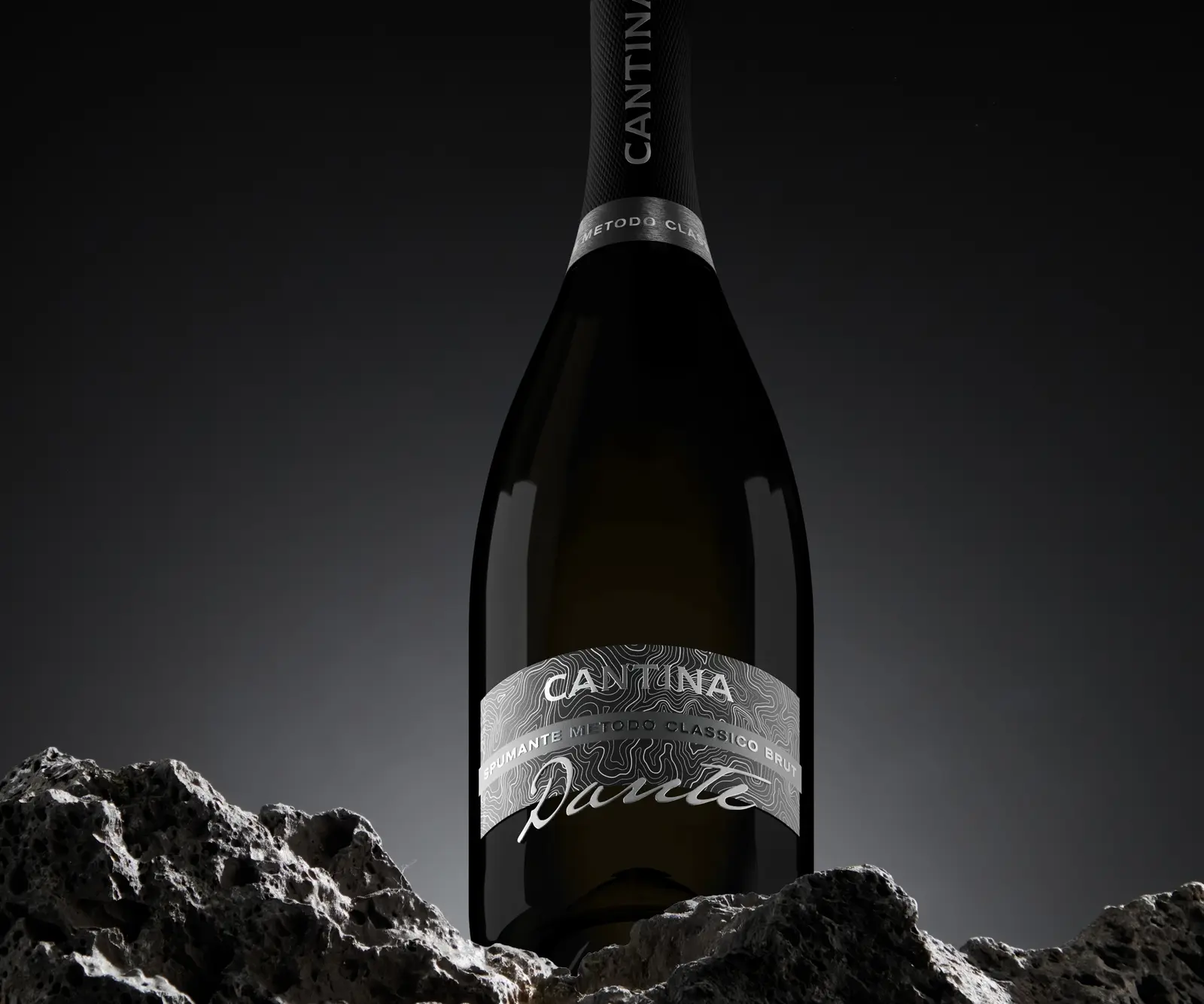 The Dante bottle on dark volcanic rock