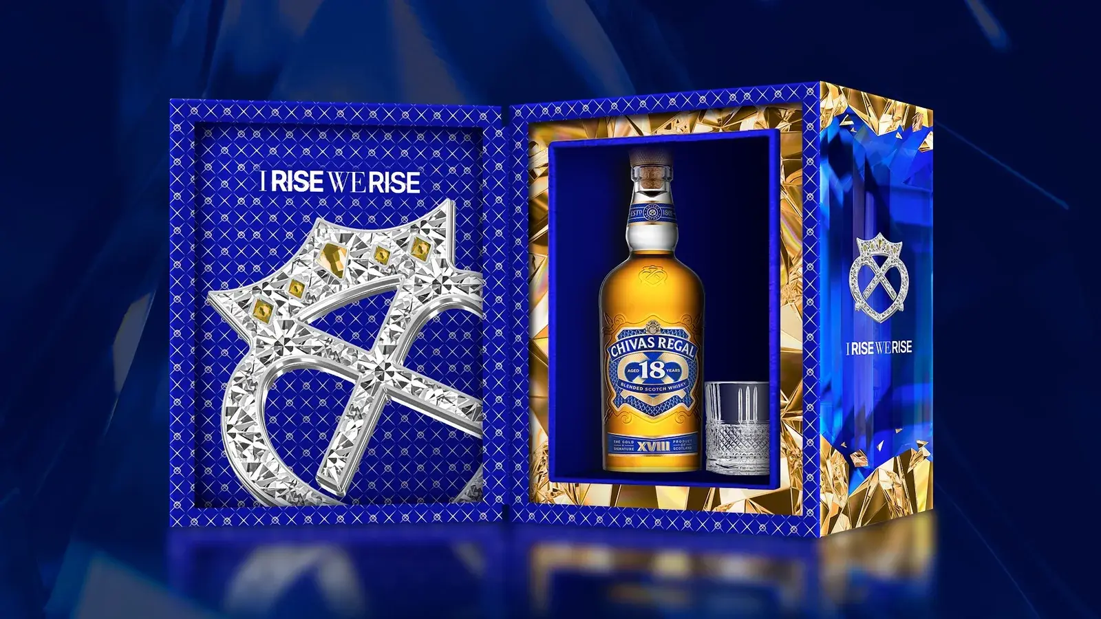 The Blue Signature gift set open — bottle beside a crystal Luckenbooth object on blue