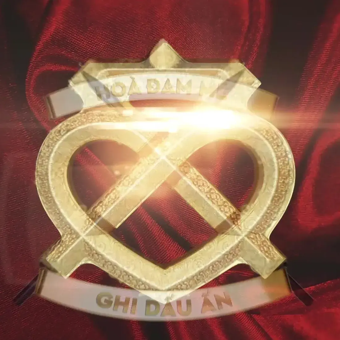 The crest element as used in the XII film — gold on red velvet