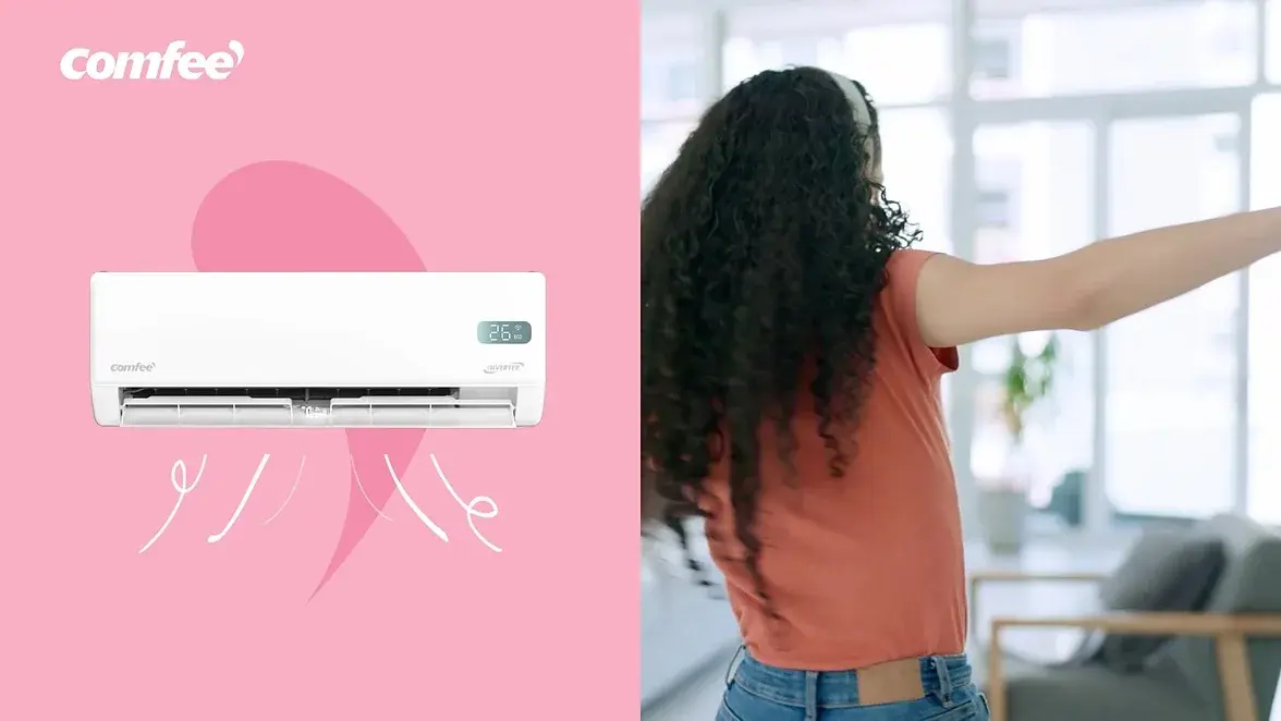 Air conditioner on pink beside a woman stretching by a window