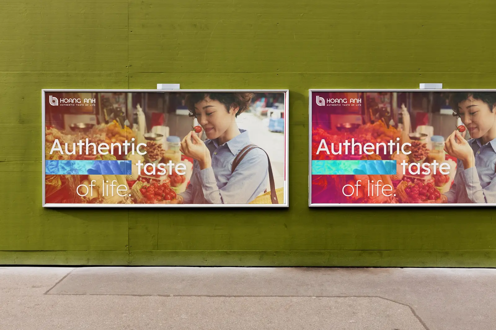 Two street billboards on a green wall carrying the Authentic taste of life line