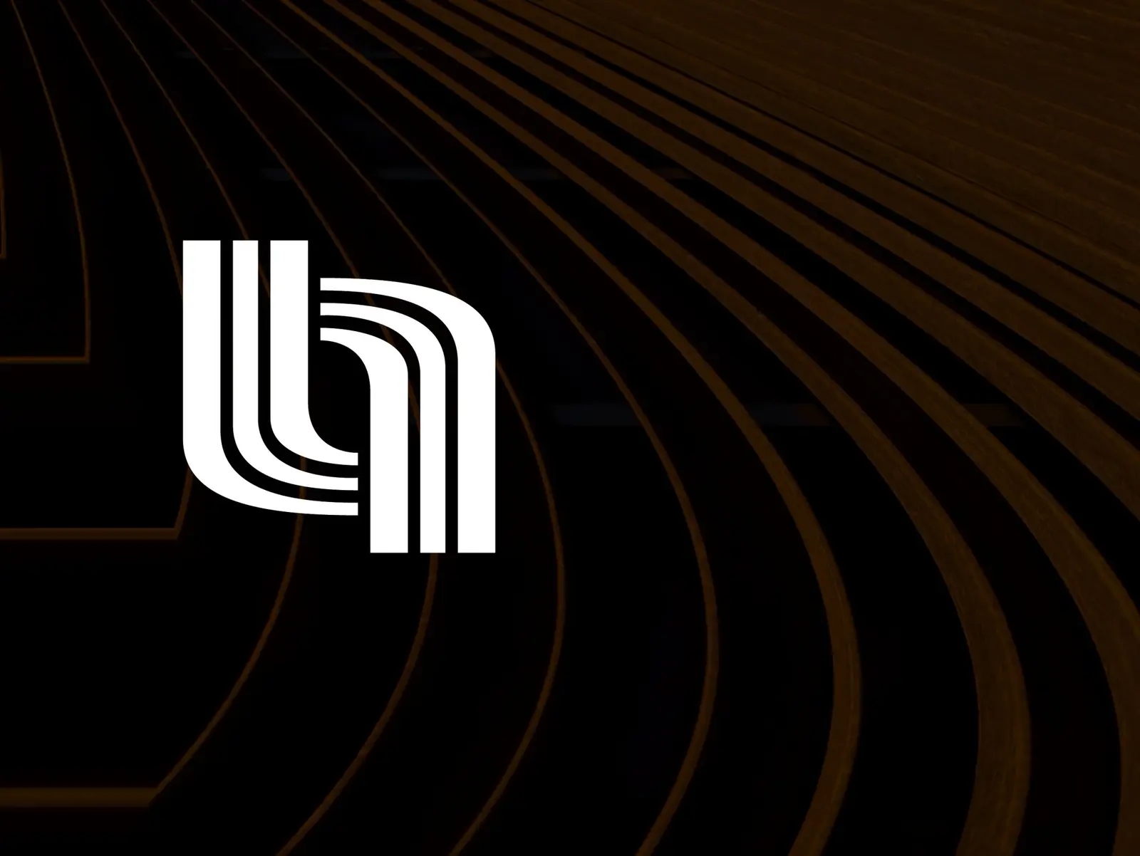 The mark on black, six strokes spiralling in and out of a central circle