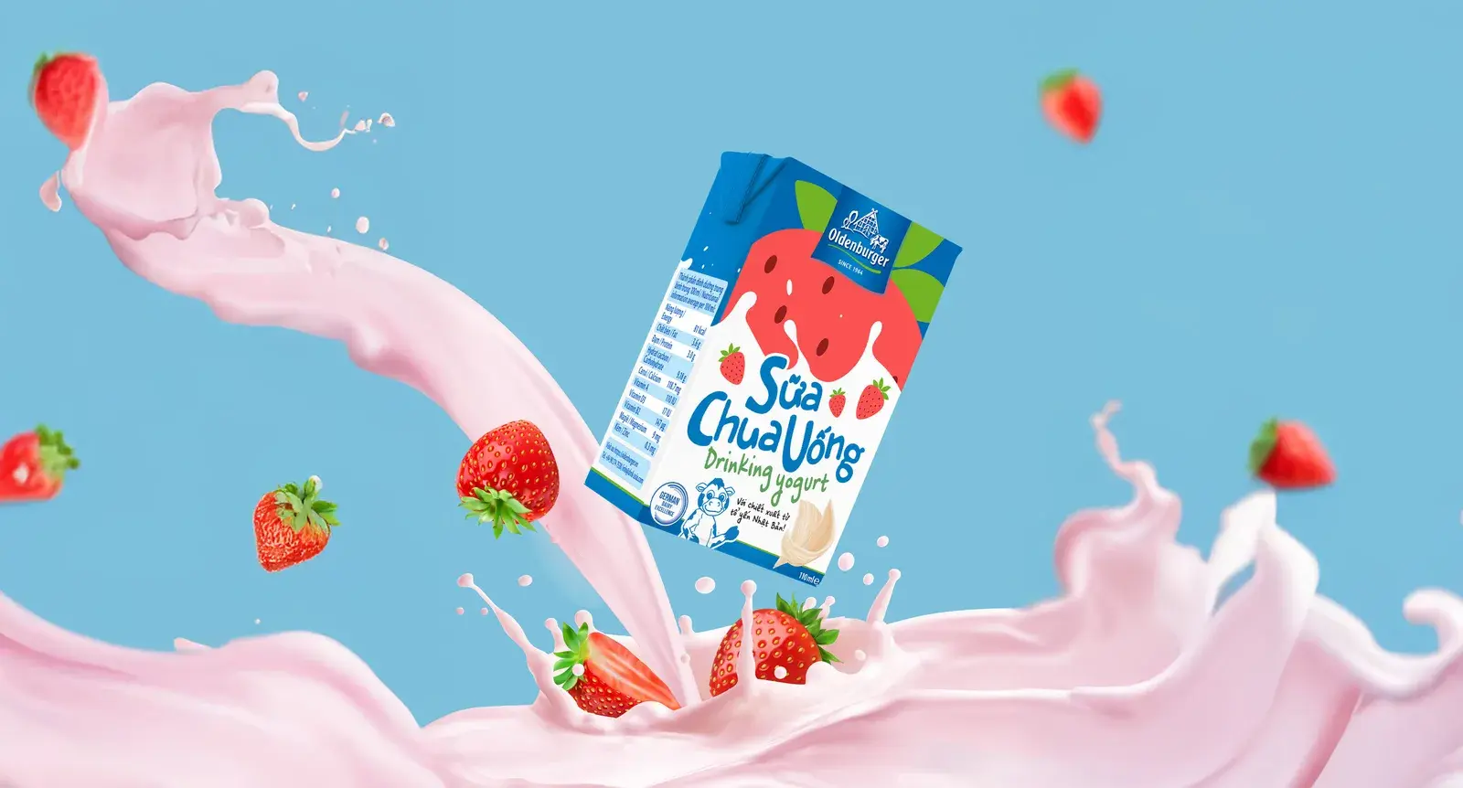 Strawberry key visual — the pack in a splash of milk with fruit around it