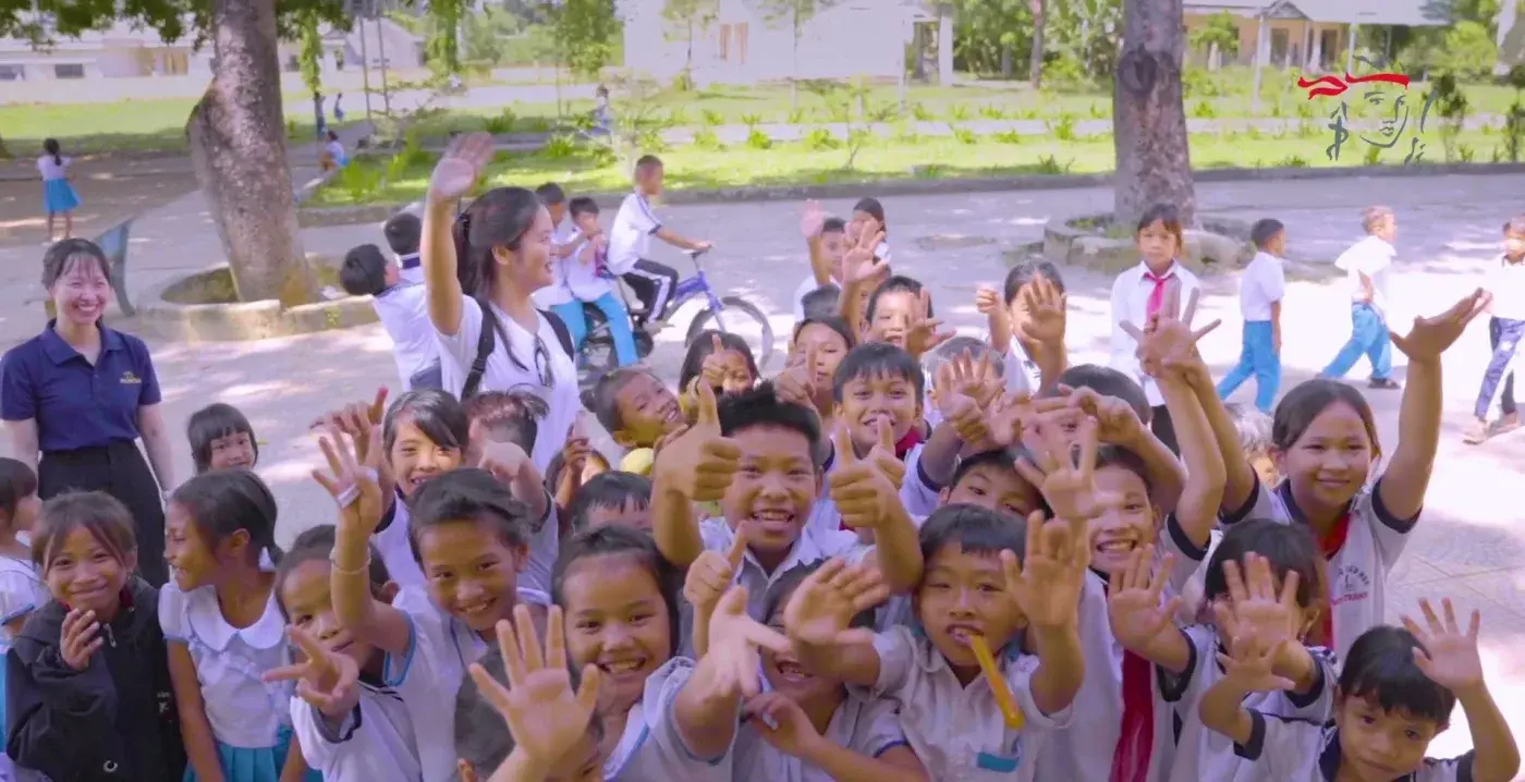 CSR film still — children at the school gate