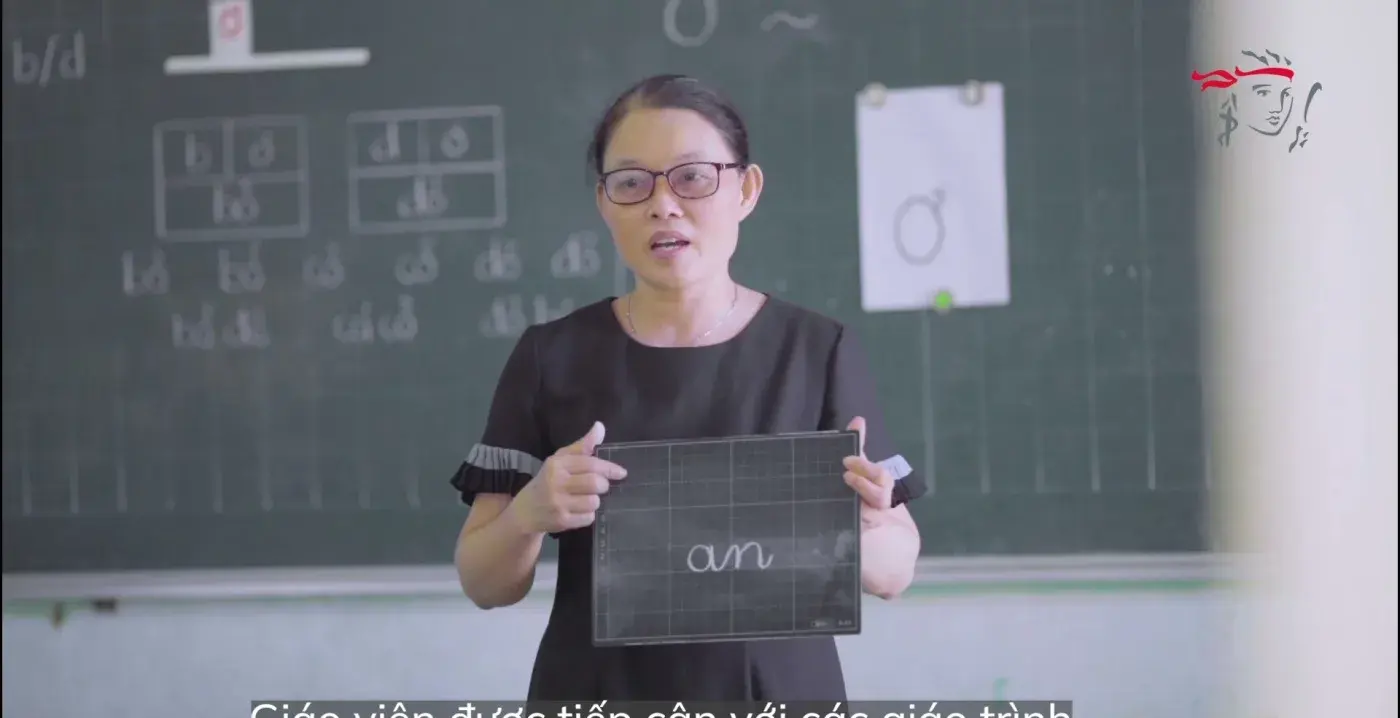 CSR film still — a teacher at the board