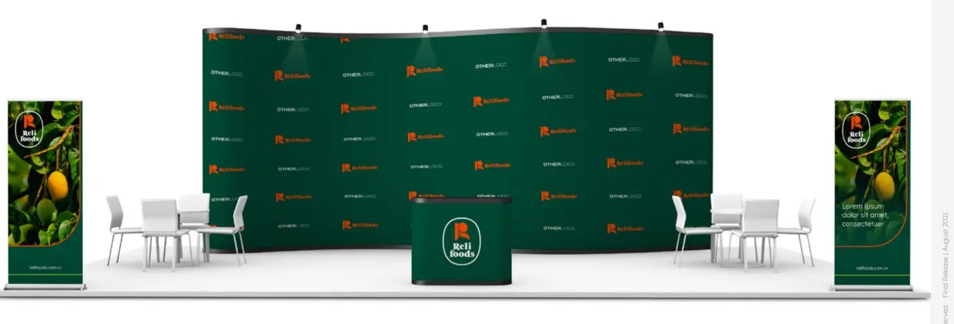 The full trade stand built out — pattern wall, screens and meeting tables