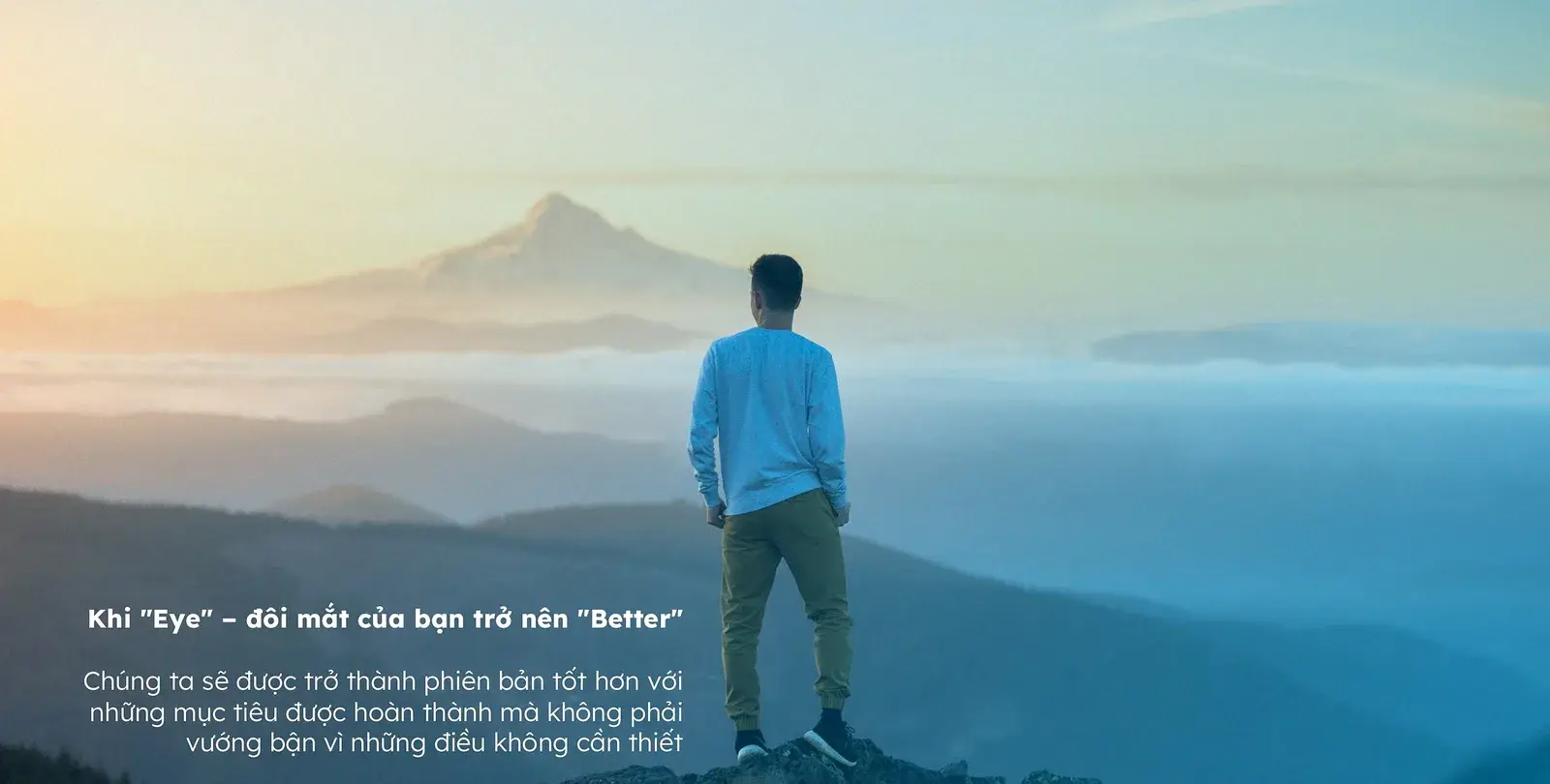 A figure standing alone before a distant peak, the "better" idea as a summit
